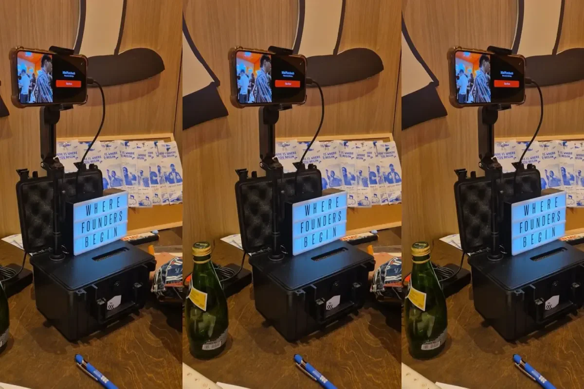 Three views of the rig at a founders' event: a phone on an arm above the printer case, with a lightbox sign reading "Where founders begin" beside it.
